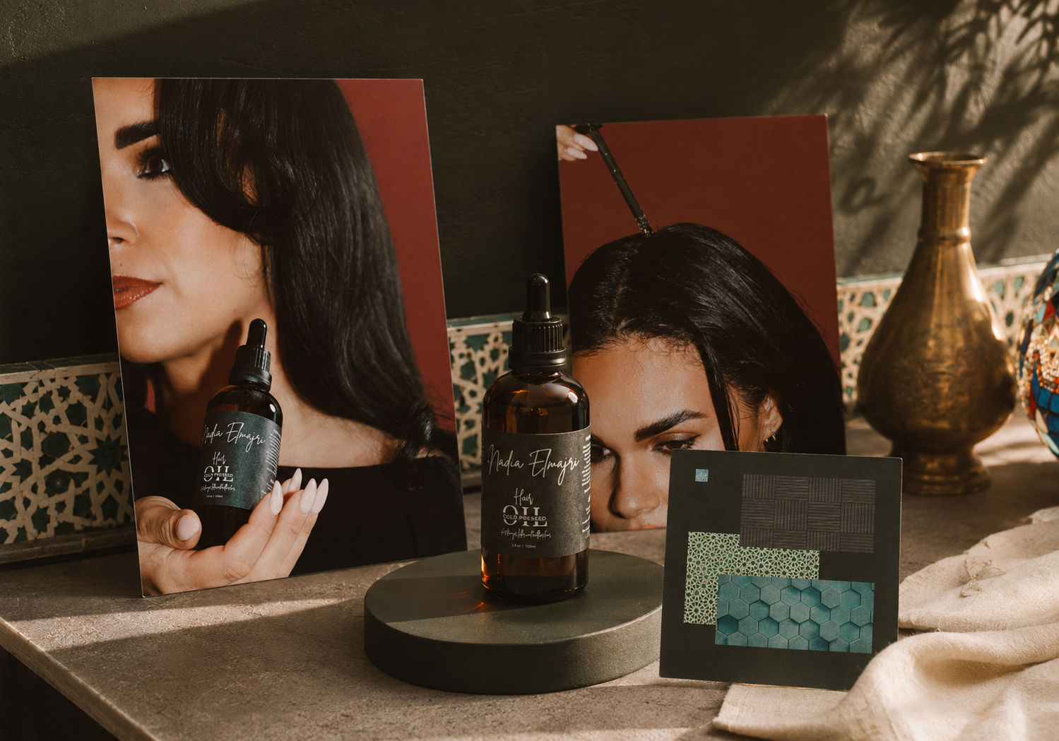 Nadia Elmajri hair oil product photography featuring branded bottles, packaging and lifestyle imagery in warm, earthy tones.